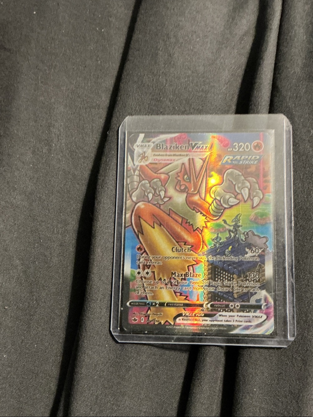 Blaziken VMAX Pokémon Card - Holographic Red Collectible